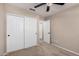 Bedroom with ceiling fan and sliding door closet at 19045 N 47Th Cir, Glendale, AZ 85308