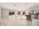 Open kitchen with island, tile flooring, and view of backyard pool at 19045 N 47Th Cir, Glendale, AZ 85308