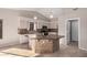 Kitchen island with granite countertop and wood cabinets at 19045 N 47Th Cir, Glendale, AZ 85308