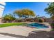 Kidney-shaped pool with surrounding patio and landscaping at 19045 N 47Th Cir, Glendale, AZ 85308