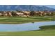 Luxury community nestled against mountains, featuring a golf course and lake at 2005 N 169Th Ave, Goodyear, AZ 85395