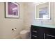 Modern bathroom with a sleek vanity, toilet and illuminated mirror at 2005 N 169Th Ave, Goodyear, AZ 85395