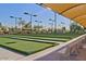 Outdoor bocce ball courts with shaded seating areas at 2005 N 169Th Ave, Goodyear, AZ 85395