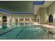 Indoor heated lap pool with modern lighting and comfortable seating at 2005 N 169Th Ave, Goodyear, AZ 85395