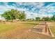 Community lawn with horseshoe pits and picnic tables at 2005 N 169Th Ave, Goodyear, AZ 85395