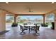 Covered patio with seating area, string lights and view of backyard at 2005 N 169Th Ave, Goodyear, AZ 85395