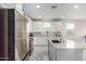 Modern kitchen with stainless steel appliances and white cabinetry at 21743 N Daniel Dr, Maricopa, AZ 85138