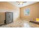 Bedroom with tile floor, safe, and pet door at 22282 E Tierra Grande Ct, Queen Creek, AZ 85142