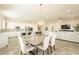 Open concept dining area with kitchen and living room views at 22282 E Tierra Grande Ct, Queen Creek, AZ 85142