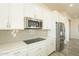 Kitchen features stainless steel appliances and gray backsplash at 22282 E Tierra Grande Ct, Queen Creek, AZ 85142