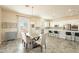 Bright kitchen with island, stainless steel appliances, and white cabinets at 22282 E Tierra Grande Ct, Queen Creek, AZ 85142