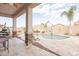 Covered patio overlooking the pool and backyard at 22282 E Tierra Grande Ct, Queen Creek, AZ 85142