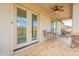 Patio with French doors leading to the backyard at 22282 E Tierra Grande Ct, Queen Creek, AZ 85142