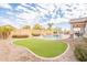 Backyard with putting green and pool at 22282 E Tierra Grande Ct, Queen Creek, AZ 85142