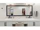 Double vanity bathroom with a large mirror and modern fixtures at 2430 E Palo Verde Dr, Phoenix, AZ 85016