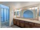 Bathroom with double vanity, granite countertop, and bathtub at 2454 W Hearn Rd, Phoenix, AZ 85023