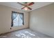 Bedroom with carpet, ceiling fan, and window coverings at 2454 W Hearn Rd, Phoenix, AZ 85023