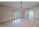 Dining area with tile floors and French doors to patio at 2454 W Hearn Rd, Phoenix, AZ 85023