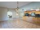 Bright dining room with tile floors and view into living room at 2454 W Hearn Rd, Phoenix, AZ 85023