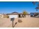 Single-story home with a two-car garage and desert landscaping at 2454 W Hearn Rd, Phoenix, AZ 85023