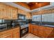 Kitchen with wood cabinets, granite countertops, and stainless steel appliances at 2454 W Hearn Rd, Phoenix, AZ 85023