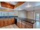 Spacious kitchen with wood cabinets and granite island at 2454 W Hearn Rd, Phoenix, AZ 85023