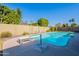 Inviting blue pool with diving board and patio area at 2454 W Hearn Rd, Phoenix, AZ 85023