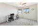 Bedroom with desk and chair, carpeted floor, and ceiling fan at 24833 W Jessica Ln, Buckeye, AZ 85326