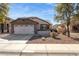 Charming one-story house with stone veneer and landscaped yard at 24833 W Jessica Ln, Buckeye, AZ 85326