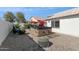 Stone hot tub in a backyard setting with gravel and landscaping at 24833 W Jessica Ln, Buckeye, AZ 85326