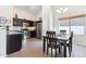 Modern kitchen with dark cabinets and stainless steel appliances at 24833 W Jessica Ln, Buckeye, AZ 85326