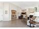 Bright living area with tile floors and views into the kitchen and dining area at 24833 W Jessica Ln, Buckeye, AZ 85326