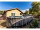 Above ground pool with wood-look exterior in sunny backyard at 2731 W Wayland Dr, Phoenix, AZ 85041