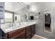 Bathroom with double vanity and textured walls at 2731 W Wayland Dr, Phoenix, AZ 85041