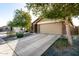 Tan house with a two-car garage and stone accents at 2731 W Wayland Dr, Phoenix, AZ 85041