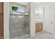 Bathroom with glass shower, built in seat, and neutral tile at 28365 N 124Th Dr, Peoria, AZ 85383