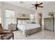 Spacious bedroom with king-size bed, hardwood floors, and ample natural light at 28365 N 124Th Dr, Peoria, AZ 85383