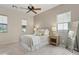 Guest bedroom with neutral decor and ceiling fan at 28365 N 124Th Dr, Peoria, AZ 85383