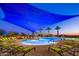 Large community pool with shade structures and lounge chairs at 28365 N 124Th Dr, Peoria, AZ 85383