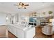 Bright living room with hardwood floors, fireplace, and built-in shelving at 28365 N 124Th Dr, Peoria, AZ 85383