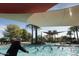 Large resort-style pool with shade structures perfect for water aerobics at 28365 N 124Th Dr, Peoria, AZ 85383