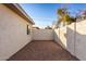 Small backyard with gravel and a stucco wall at 2916 S Price Rd, Tempe, AZ 85282