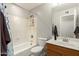 Clean bathroom with a bathtub, toilet and wood vanity at 2916 S Price Rd, Tempe, AZ 85282