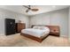 Spacious bedroom with wood platform bed and ceiling fan at 2916 S Price Rd, Tempe, AZ 85282