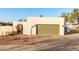 Modern home exterior with a large garage door at 2916 S Price Rd, Tempe, AZ 85282