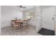 Dining area with hexagonal table and four chairs at 3270 S Goldfield Rd # 203, Apache Junction, AZ 85119