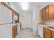 Kitchen with light wood cabinets, white appliances, and tile floor at 3270 S Goldfield Rd # 203, Apache Junction, AZ 85119