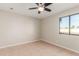 Spacious bedroom with tile floors and window at 3301 E Larkspur Dr, Phoenix, AZ 85032