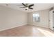 Spacious bedroom with tile floors and ceiling fan at 3301 E Larkspur Dr, Phoenix, AZ 85032