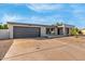 Newly renovated home with modern facade, two-car garage, and driveway at 3301 E Larkspur Dr, Phoenix, AZ 85032